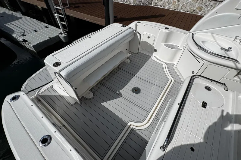 Slide: The Image of 2006 Sea Ray 340 Sundancer boat deck with seating and storage compartments. - 17