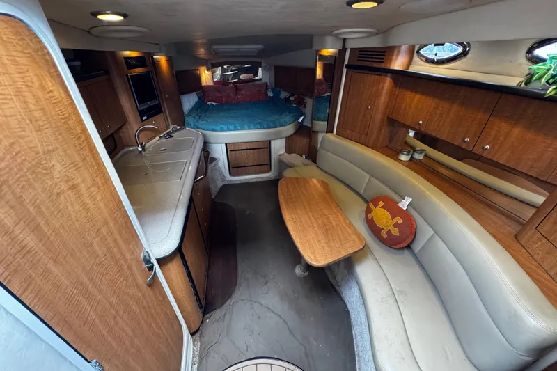 Slide: The Image of Interior of 2006 Sea Ray 340 Sundancer yacht with cozy seating and kitchenette. - 30