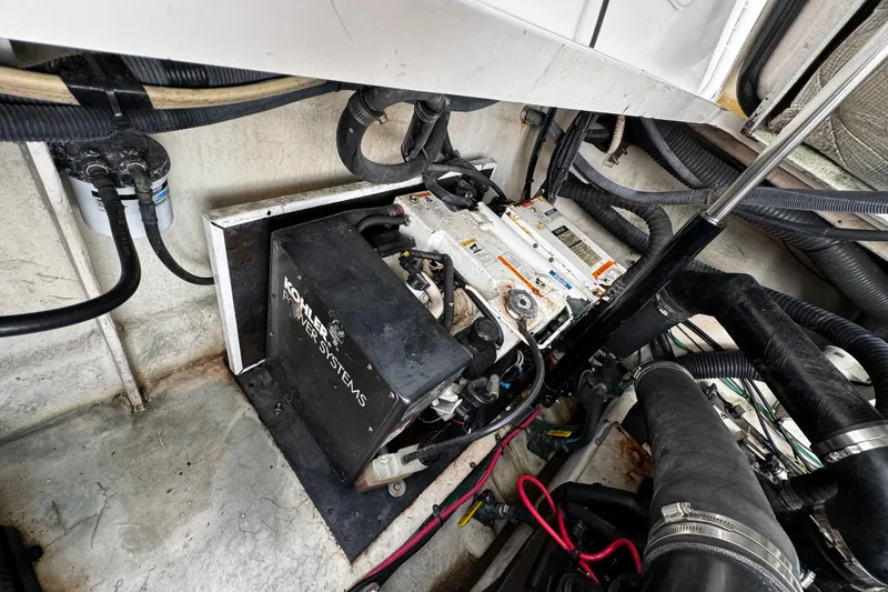 Slide: The Image of Engine compartment of a 2006 Sea Ray 340 Sundancer with Kohler power systems. - 48