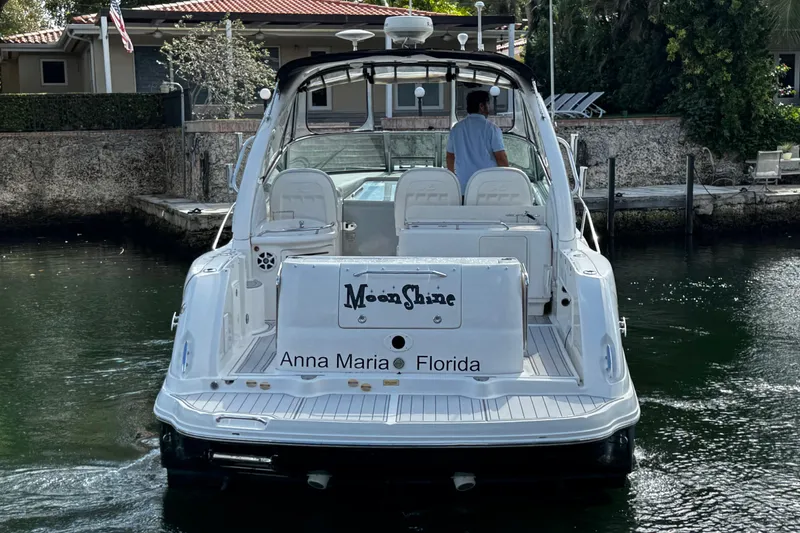 Slide: The Image of 2006 Sea Ray 340 Sundancer boat named "Moon Shine" docked in Anna Maria, Florida. - 8