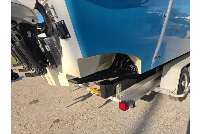 Slide: The Image of 2012 Fountain 38 Center Console boat on trailer, rear view with outboard motor. - 18