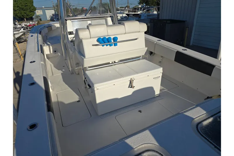 Slide: The Image of 2012 Fountain 38 Center Console boat interior with seating and storage. - 19