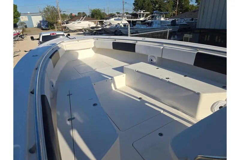 Slide: The Image of 2012 Fountain 38 Center Console boat interior, spacious seating, and storage compartments. - 32
