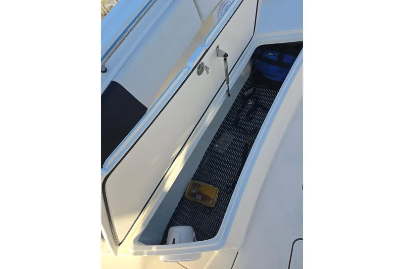 Slide: The Image of Open storage compartment on 2012 Fountain 38 Center Console boat. - 35