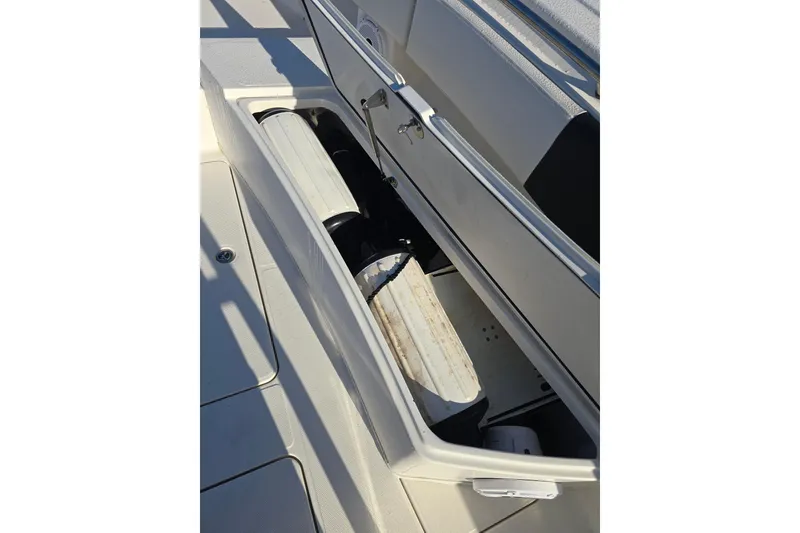 Slide: The Image of Open storage compartment on 2012 Fountain 38 Center Console boat. - 36
