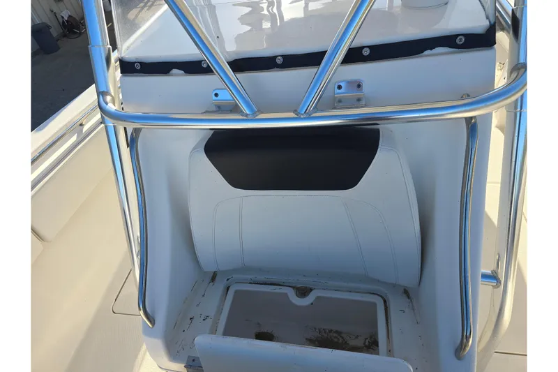 Slide: The Image of 2012 Fountain 38 Center Console boat interior with stainless steel railings and storage compartment. - 37