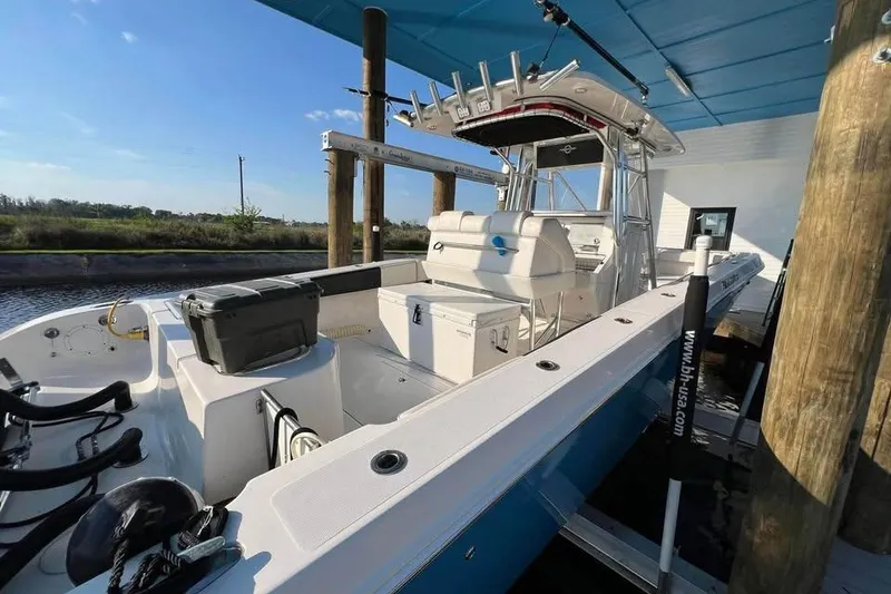 Slide: The Image of Close-up of 2012 Fountain 38 Center Console boat gauges displaying RPM and voltage. - 9