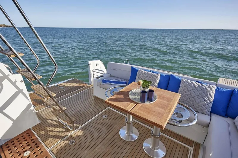 Slide: The Image of Luxurious deck of 2026 Beneteau Antares 12 Fly OB yacht with ocean view. - 3