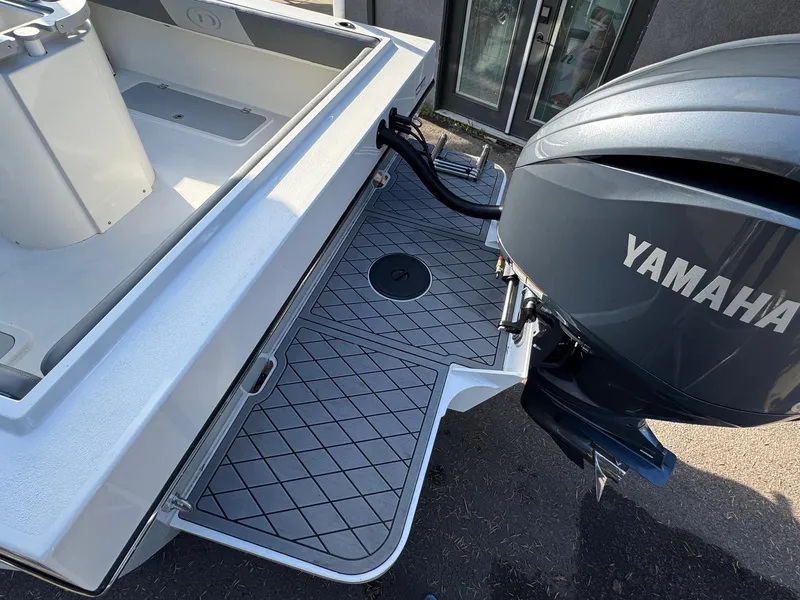 Slide: The Image of 2025 Defiance Admiral 220 EX boat with Yamaha outboard motor, featuring a spacious deck. - 18