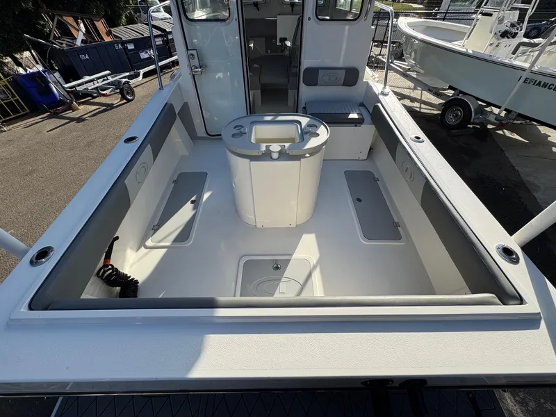 Slide: The Image of 2025 Defiance Admiral 220 EX boat interior with spacious deck and seating. - 20
