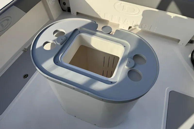 Slide: The Image of Livewell on 2025 Defiance Admiral 220 EX boat, featuring cup holders and storage. - 27