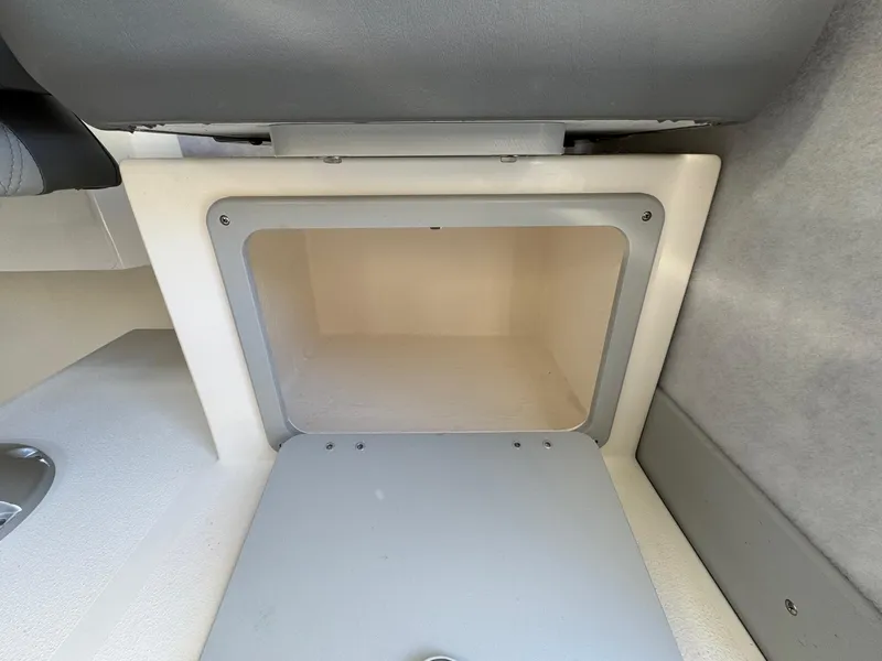 Slide: The Image of Storage compartment in 2025 Defiance Admiral 220 EX boat interior. - 35