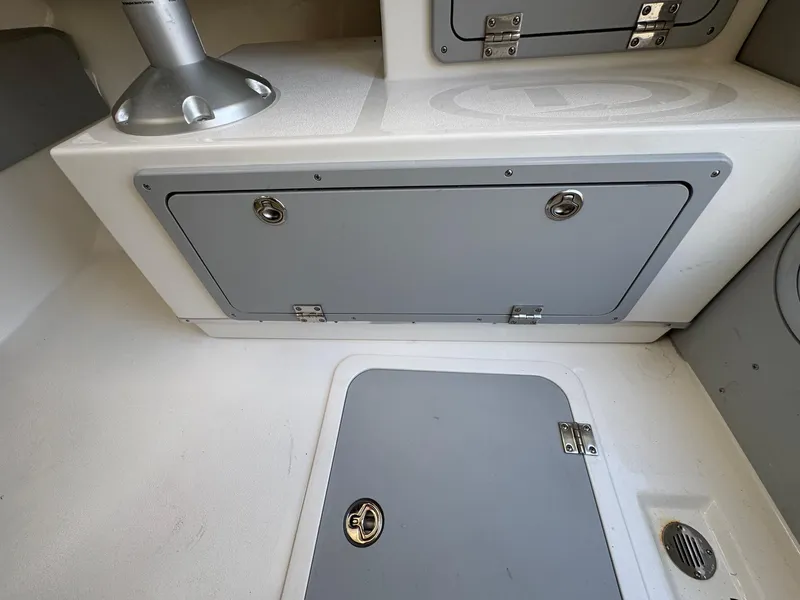 Slide: The Image of Interior storage compartments of 2025 Defiance Admiral 220 EX boat. - 36