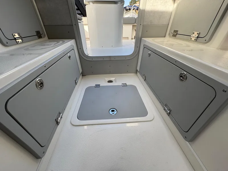 Slide: The Image of Interior storage area of 2025 Defiance Admiral 220 EX boat, featuring secure compartments. - 38