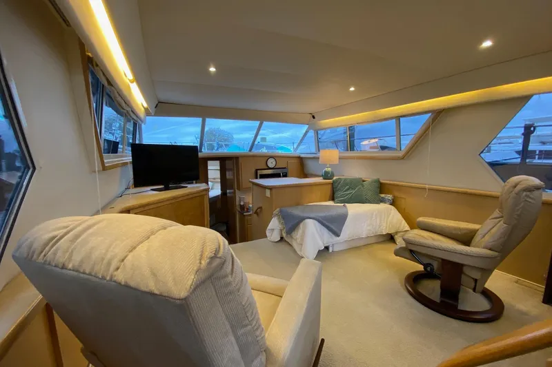Slide: The Image of Luxurious interior of 1998 Carver 445 Aft Cabin Motor Yacht with cozy seating and bed. - 18