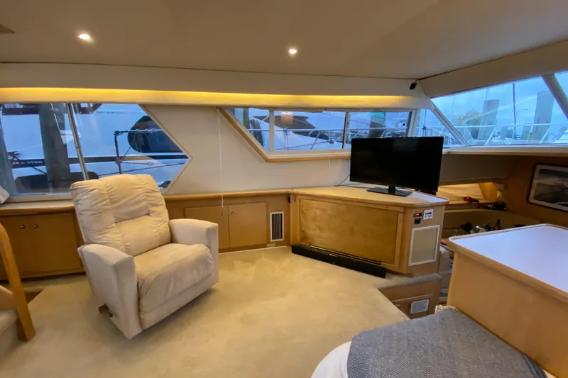 Slide: The Image of Interior of 1998 Carver 445 Aft Cabin Motor Yacht with recliner and TV. - 19