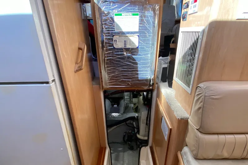 Slide: The Image of Interior view of 1998 Carver 445 Aft Cabin Motor Yacht, showing equipment and seating area. - 41