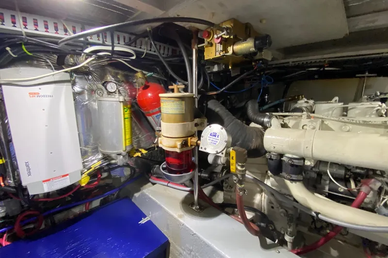 Slide: The Image of Engine room of 1998 Carver 445 Aft Cabin Motor Yacht with mechanical components. - 51