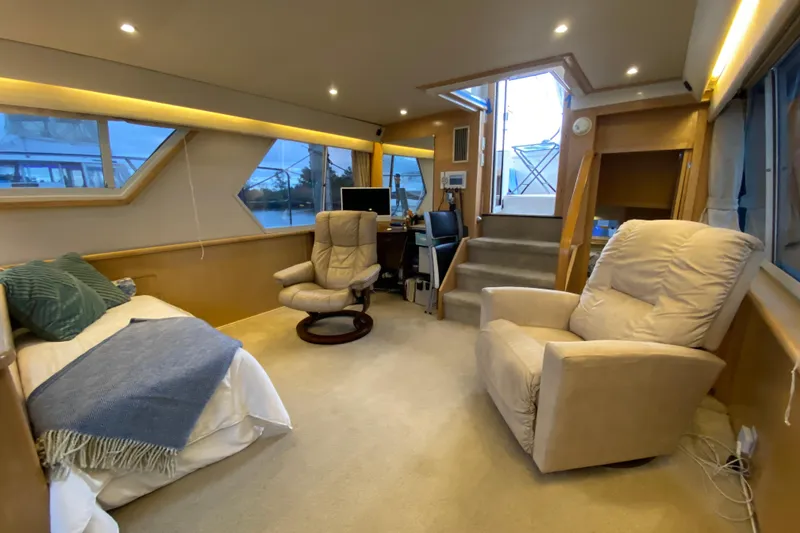 Slide: The Image of Interior of 1998 Carver 445 Aft Cabin Motor Yacht with cozy seating and modern decor. - 20