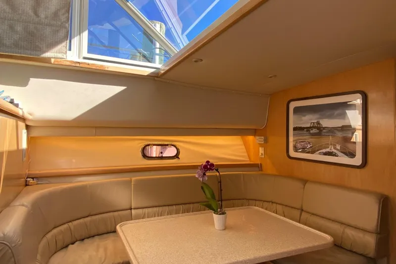 Slide: The Image of Interior of 1998 Carver 445 Aft Cabin Motor Yacht with seating and table. - 25