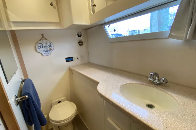 Slide: The Image of Bathroom interior of 1998 Carver 445 Aft Cabin Motor Yacht with sink and toilet. - 35