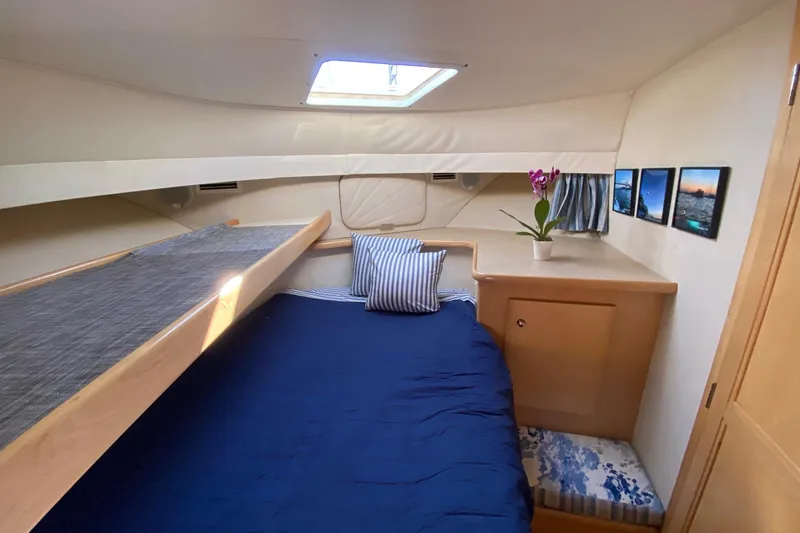 Slide: The Image of Interior of 1998 Carver 445 Aft Cabin Motor Yacht with cozy bed and decor. - 37