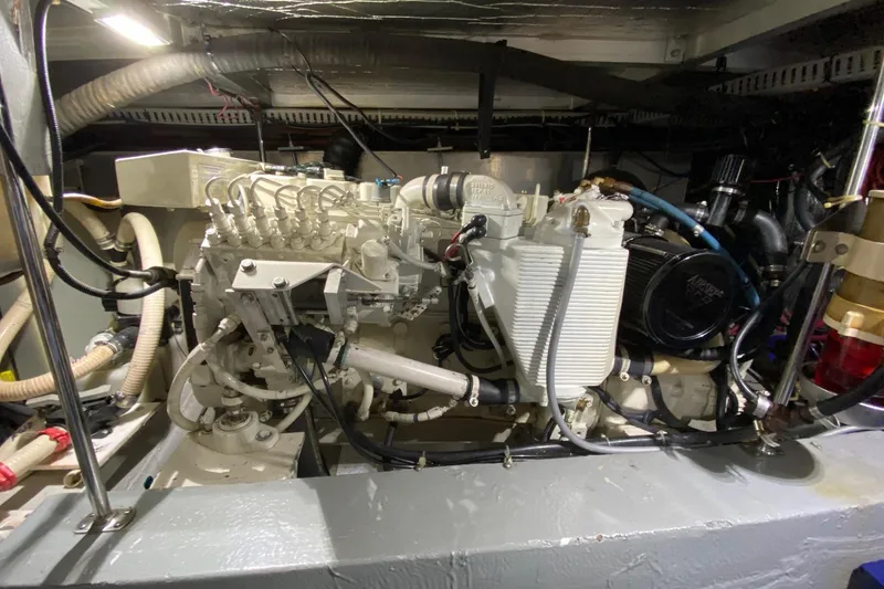 Slide: The Image of Engine room of 1998 Carver 445 Aft Cabin Motor Yacht, showcasing mechanical components. - 45
