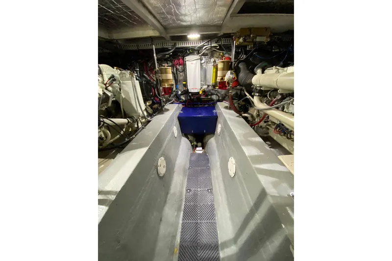 Slide: The Image of Engine room of 1998 Carver 445 Aft Cabin Motor Yacht, showcasing mechanical components. - 46