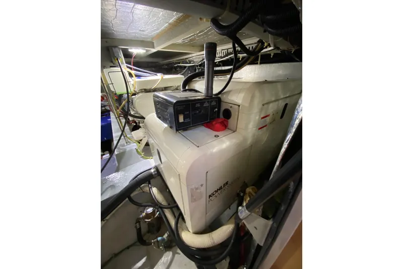 Slide: The Image of Engine room of 1998 Carver 445 Aft Cabin Motor Yacht with Kohler generator. - 47