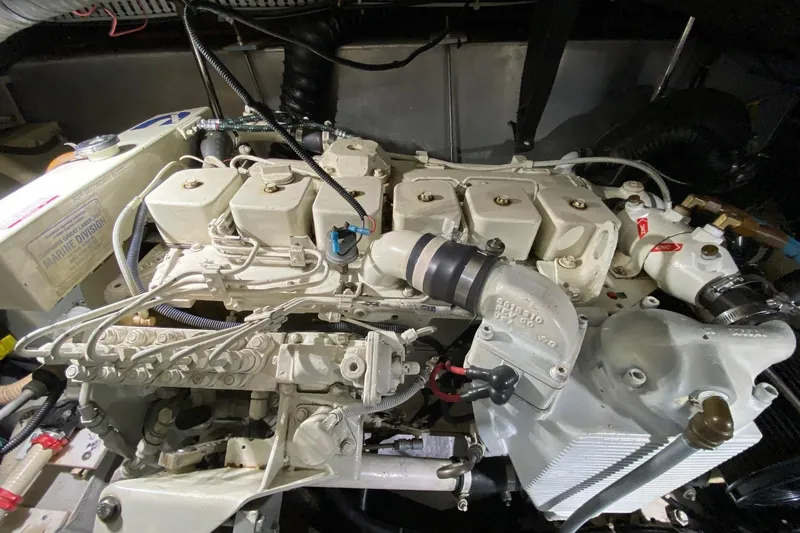 Slide: The Image of Engine room of 1998 Carver 445 Aft Cabin Motor Yacht, showcasing detailed machinery. - 49