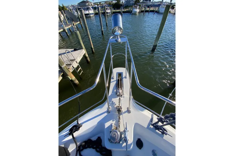 Slide: The Image of Bow view of 1998 Carver 445 Aft Cabin Motor Yacht docked at marina. - 9