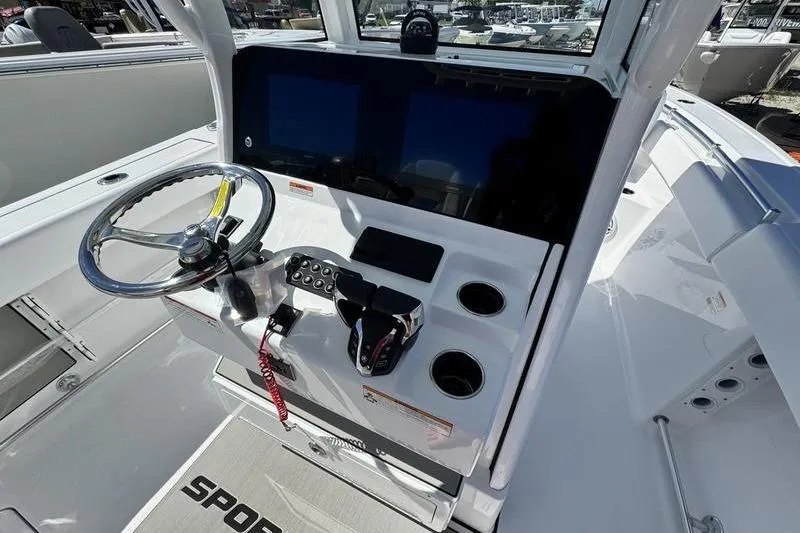 Slide: The Image of 2026 Sportsman Open 262 Center Console boat dashboard with steering wheel and controls. - 18