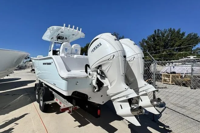 Slide: The Image of 2026 Sportsman Open 262 Center Console boat with dual Yamaha engines on a trailer. - 2