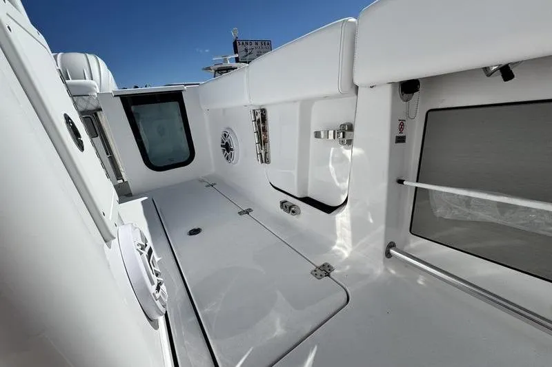 Slide: The Image of 2026 Sportsman Open 262 Center Console interior with sleek white design and modern features. - 25