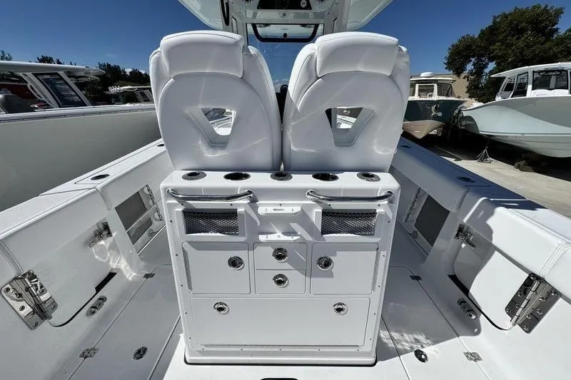 Slide: The Image of 2026 Sportsman Open 262 Center Console boat interior with dual seats and storage compartments. - 27