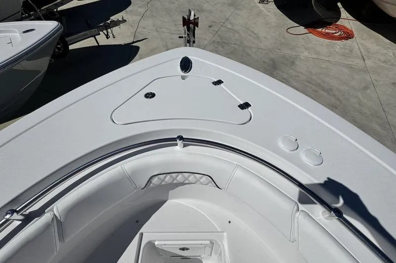 Slide: The Image of 2026 Sportsman Open 262 Center Console boat bow, featuring sleek design and storage compartments. - 3