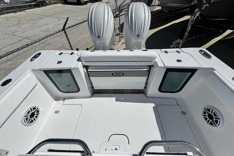 Slide: The Image of 2026 Sportsman Open 262 Center Console boat with dual engines and spacious deck layout. - 30