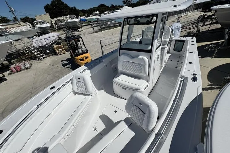 Slide: The Image of 2026 Sportsman Open 262 Center Console boat with spacious seating and modern design. - 34