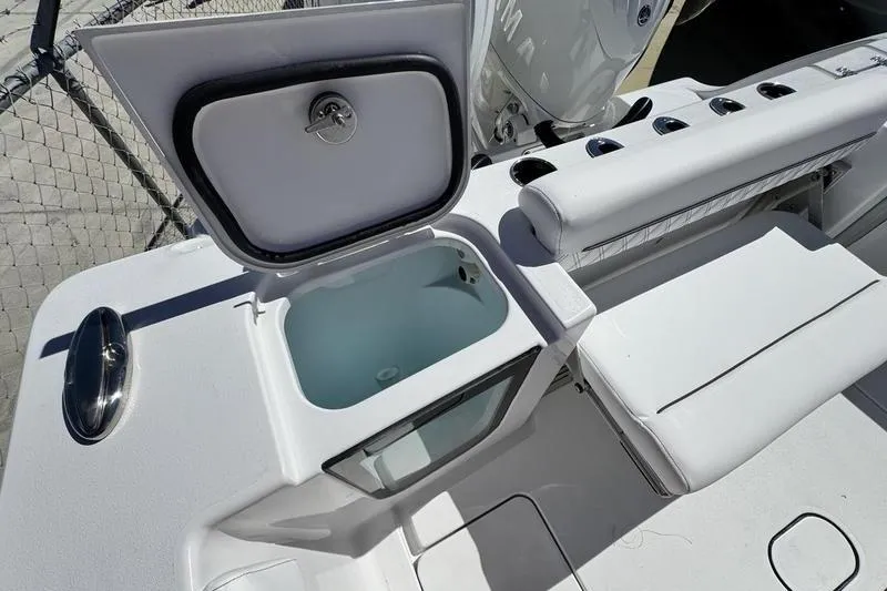 Slide: The Image of 2026 Sportsman Open 262 Center Console boat with open storage compartment. - 36