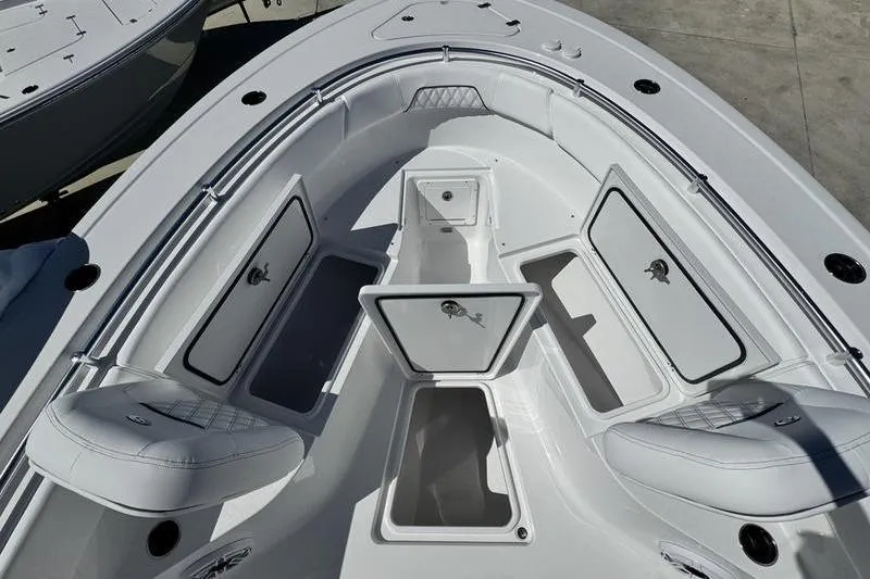 Slide: The Image of 2026 Sportsman Open 262 Center Console boat with open storage compartments. - 6