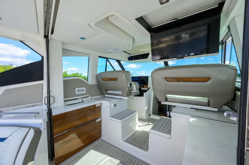 Slide: The Image of Luxurious interior of 2022 Tiara Yachts 43 LE with modern seating and entertainment system. - 31