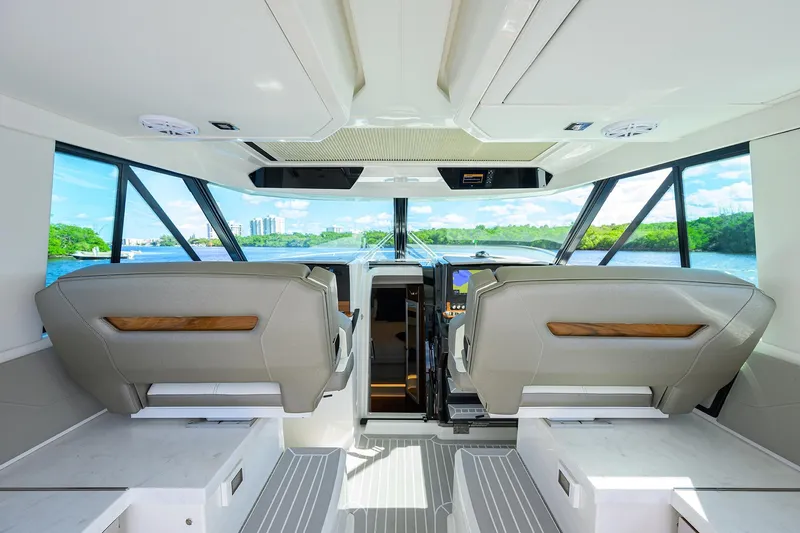 Slide: The Image of Interior view of 2022 Tiara Yachts 43 LE, featuring modern helm and seating. - 32