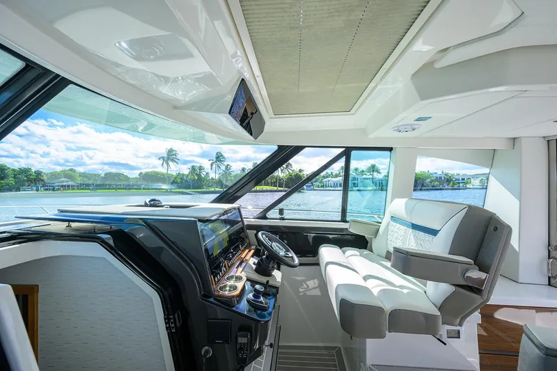 Slide: The Image of Interior of 2022 Tiara Yachts 43 LE, featuring modern helm and luxurious seating. - 35