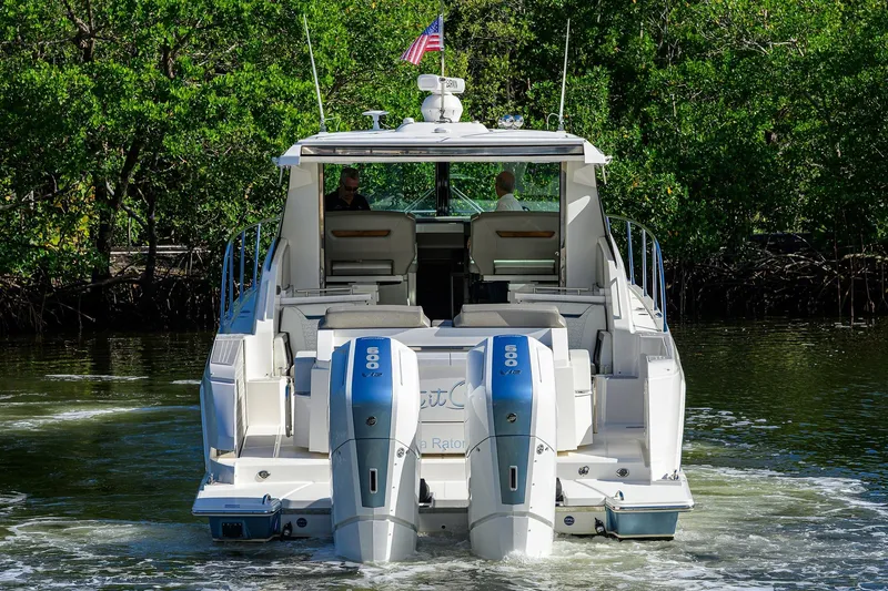 Slide: The Image of 2022 Tiara Yachts 43 LE with dual 600 horsepower engines cruising on a river. - 6