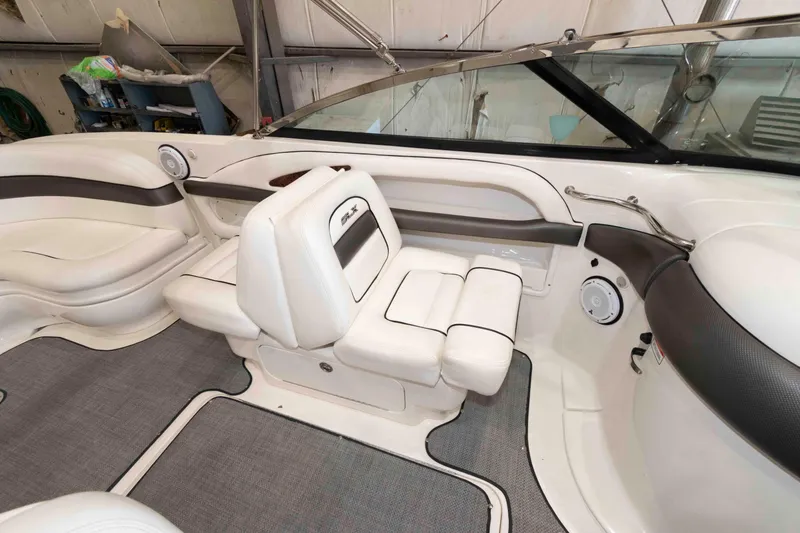 Slide: The Image of Interior of a 2006 Sea Ray 290 SLX boat with white seating and gray accents. - 13