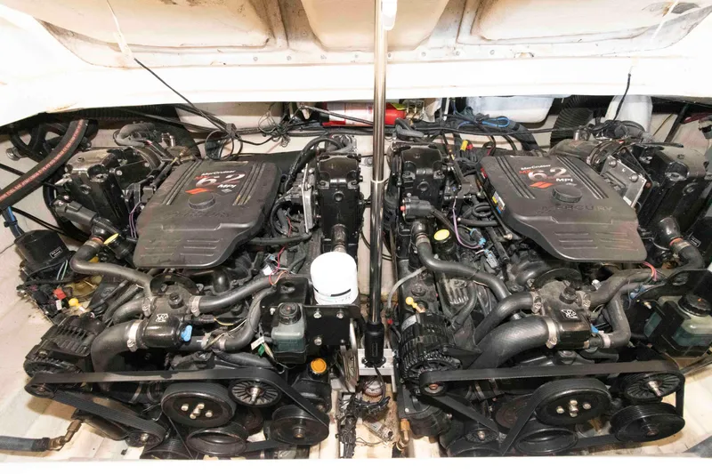 Slide: The Image of Twin Mercury engines in a 2006 Sea Ray 290 SLX boat engine compartment. - 17