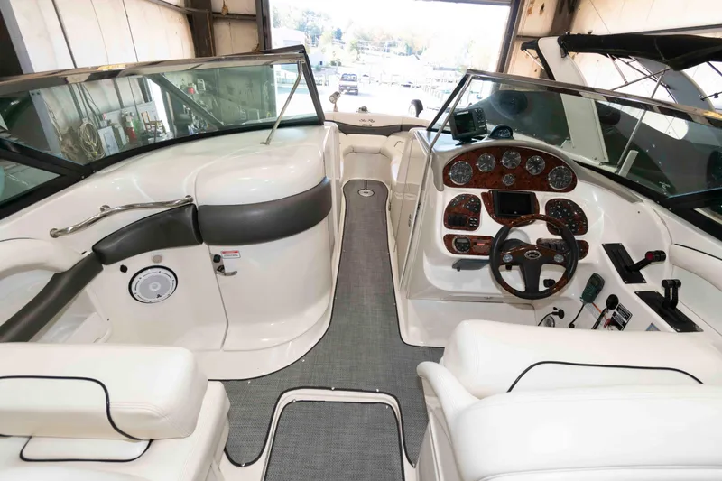 Slide: The Image of 2006 Sea Ray 290 SLX boat interior with steering wheel and dashboard controls. - 7