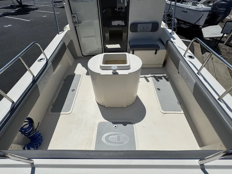 Slide: The Image of 2023 Defiance Admiral 220 EX boat docked at marina, sunny day. - 15