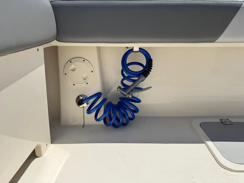 Slide: The Image of 2023 Defiance Admiral 220 EX with Mercury outboard engine, docked on calm water. - 17