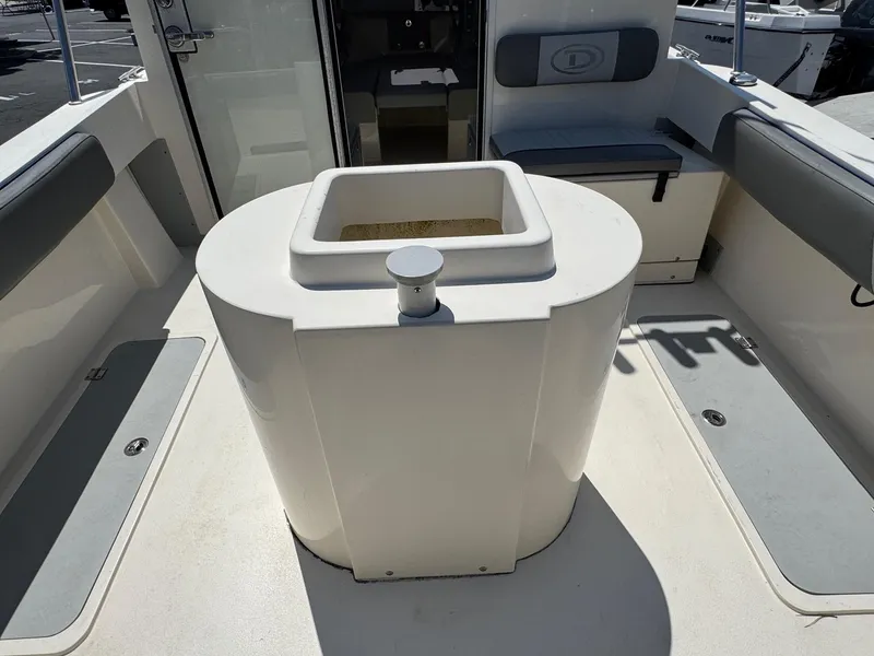 Slide: The Image of 2023 Defiance Admiral 220 EX boat deck with storage compartment. - 22